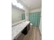 Well-lit bathroom with granite countertops and a modern shower curtain at 4245 W Fork Dr, Westfield, IN 46062