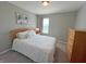 Cozy bedroom featuring a queen bed, soft lighting, and a dresser at 4245 W Fork Dr, Westfield, IN 46062