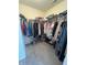 Walk-in closet with ample storage space and shoe racks on the floor at 4245 W Fork Dr, Westfield, IN 46062