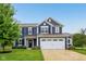 Beautiful two-story home with a well-maintained lawn, manicured landscaping, and a two-car garage at 4245 W Fork Dr, Westfield, IN 46062