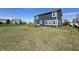 Exterior view showcasing the home's large backyard and patio area at 4245 W Fork Dr, Westfield, IN 46062