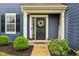 Charming front door with a wreath, beautiful landscaping, and a welcoming entrance at 4245 W Fork Dr, Westfield, IN 46062