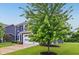 Charming two-story home with a well-manicured lawn, a two-car garage, and a beautiful blue exterior at 4245 W Fork Dr, Westfield, IN 46062