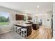 Beautiful kitchen with dark wood cabinets, granite countertops, and a center island with seating at 4245 W Fork Dr, Westfield, IN 46062