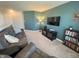 Relaxing living room with plush sofa, entertainment center, and warm lighting at 4245 W Fork Dr, Westfield, IN 46062