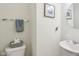 Clean powder room with a modern sink, toilet, and decor at 4245 W Fork Dr, Westfield, IN 46062