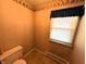 Small bathroom with tile floors and wallpaper at 4335 River Rd, Columbus, IN 47203