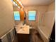 Tiled bathroom with a large vanity, medicine cabinet, and tub with shower at 4335 River Rd, Columbus, IN 47203