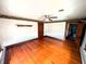Bedroom with original hardwood floors, clean walls, and a ceiling fan at 4335 River Rd, Columbus, IN 47203