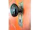 A close-up of a vintage door knob and plate showcasing the property's unique architectural details at 4335 River Rd, Columbus, IN 47203