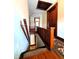 Hallway featuring hardwood floors, rug runner and wood trim at 4335 River Rd, Columbus, IN 47203