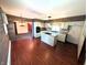 Bright kitchen featuring a center island with cooktop and modern cabinetry with adjacent dining area at 4335 River Rd, Columbus, IN 47203
