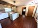 A traditional kitchen with an island, white cabinets, and a sink under the window to allow natural light at 4335 River Rd, Columbus, IN 47203