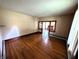 Open living room features hardwood floors and decorative woodwork, creating an inviting and comfortable space at 4335 River Rd, Columbus, IN 47203