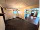 Living room with light colored walls and a view to the kitchen with hardwood floors at 4335 River Rd, Columbus, IN 47203