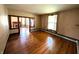 Spacious living room showcases hardwood floors and an open layout, perfect for entertaining and Gathering living at 4335 River Rd, Columbus, IN 47203