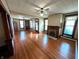Spacious living room featuring a fireplace, hardwood floors, and large windows offering natural light and warmth at 4335 River Rd, Columbus, IN 47203