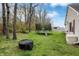 Spacious backyard with a trampoline, firepit, and plenty of room for outdoor activities at 4511 Hunt Master Ct, Indianapolis, IN 46268