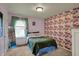 Charming bedroom with floral wallpaper, a comfortable bed, and a bright window at 4511 Hunt Master Ct, Indianapolis, IN 46268