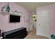 Bedroom featuring a black dresser with a flat screen tv and shelf with decor at 4511 Hunt Master Ct, Indianapolis, IN 46268