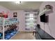 bedroom with a bunk bed, themed decor, and plenty of space at 4511 Hunt Master Ct, Indianapolis, IN 46268