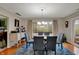 Cozy dining room with hardwood floors, stylish chairs, and lots of natural light at 4511 Hunt Master Ct, Indianapolis, IN 46268