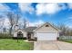 Charming single-story home with a well-maintained lawn and attached two-car garage at 4511 Hunt Master Ct, Indianapolis, IN 46268
