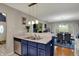 Open concept kitchen with stainless steel appliances and a breakfast bar at 4511 Hunt Master Ct, Indianapolis, IN 46268