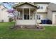 Backyard featuring a screened patio and manicured lawn at 5266 Hickory Lake Dr, Indianapolis, IN 46235
