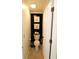Cozy half bathroom with dark accent wall and white door and toilet at 5266 Hickory Lake Dr, Indianapolis, IN 46235