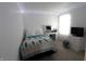 Bright bedroom with modern vanity, white walls, and soft lighting, creating a serene and inviting atmosphere at 5266 Hickory Lake Dr, Indianapolis, IN 46235