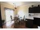 Cozy breakfast nook with a round table, seating for four, and a sliding glass door to the patio at 5266 Hickory Lake Dr, Indianapolis, IN 46235