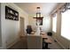 Tastefully decorated dining room with a modern chandelier, seating for six, and minimalist wall decor at 5266 Hickory Lake Dr, Indianapolis, IN 46235