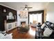 Cozy living room features a fireplace, hardwood floors, modern decor, and comfortable seating arrangement at 5266 Hickory Lake Dr, Indianapolis, IN 46235