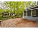 Expansive wood deck with access to the screened porch and wooded surroundings at 5467 Winterhazel Dr, Indianapolis, IN 46254