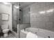 Bathroom featuring a separate shower and tub, toilet and towel rack at 5467 Winterhazel Dr, Indianapolis, IN 46254
