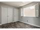 Bright bedroom with wood floors, natural lighting and double closets at 5467 Winterhazel Dr, Indianapolis, IN 46254