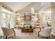 Bright living room with built-in shelving, a neutral-toned sofa, decorative accents, and natural light at 5467 Winterhazel Dr, Indianapolis, IN 46254