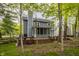 Charming two-story home featuring a large wooden deck, screened-in porch, and a well-maintained yard at 5467 Winterhazel Dr, Indianapolis, IN 46254