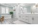 Elegant bathroom with a soaking tub, double vanity, and stylish tile flooring at 5872 Lake Kessler Ct, Indianapolis, IN 46226