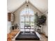 Dining area features a vaulted ceiling, large arched window, and views of the lake at 5872 Lake Kessler Ct, Indianapolis, IN 46226