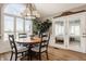 Dining area with an arched window overlooking the lake and backyard at 5872 Lake Kessler Ct, Indianapolis, IN 46226