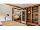 Well-lit home office showing access to bedroom; showcasing functional and stylish space at 5872 Lake Kessler Ct, Indianapolis, IN 46226