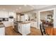 Open kitchen design features white cabinetry, stainless steel appliances, and a granite-topped center island at 5872 Lake Kessler Ct, Indianapolis, IN 46226
