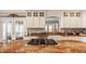 Gourmet kitchen with custom cabinets, granite counters, and a cooktop island perfect for entertaining at 5872 Lake Kessler Ct, Indianapolis, IN 46226