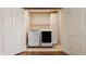 Convenient laundry closet with modern washer, dryer, and built-in storage cabinet at 5872 Lake Kessler Ct, Indianapolis, IN 46226