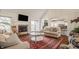 Bright living room with fireplace, large windows, and views of the water at 5872 Lake Kessler Ct, Indianapolis, IN 46226