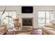 Inviting living room featuring a fireplace, natural light, and stylish furnishings at 5872 Lake Kessler Ct, Indianapolis, IN 46226