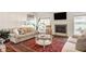 Cozy living room featuring a fireplace, comfortable seating, and bright windows at 5872 Lake Kessler Ct, Indianapolis, IN 46226