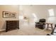 Bright loft featuring skylights, plush seating, and elegant wooden chest of drawers at 5872 Lake Kessler Ct, Indianapolis, IN 46226